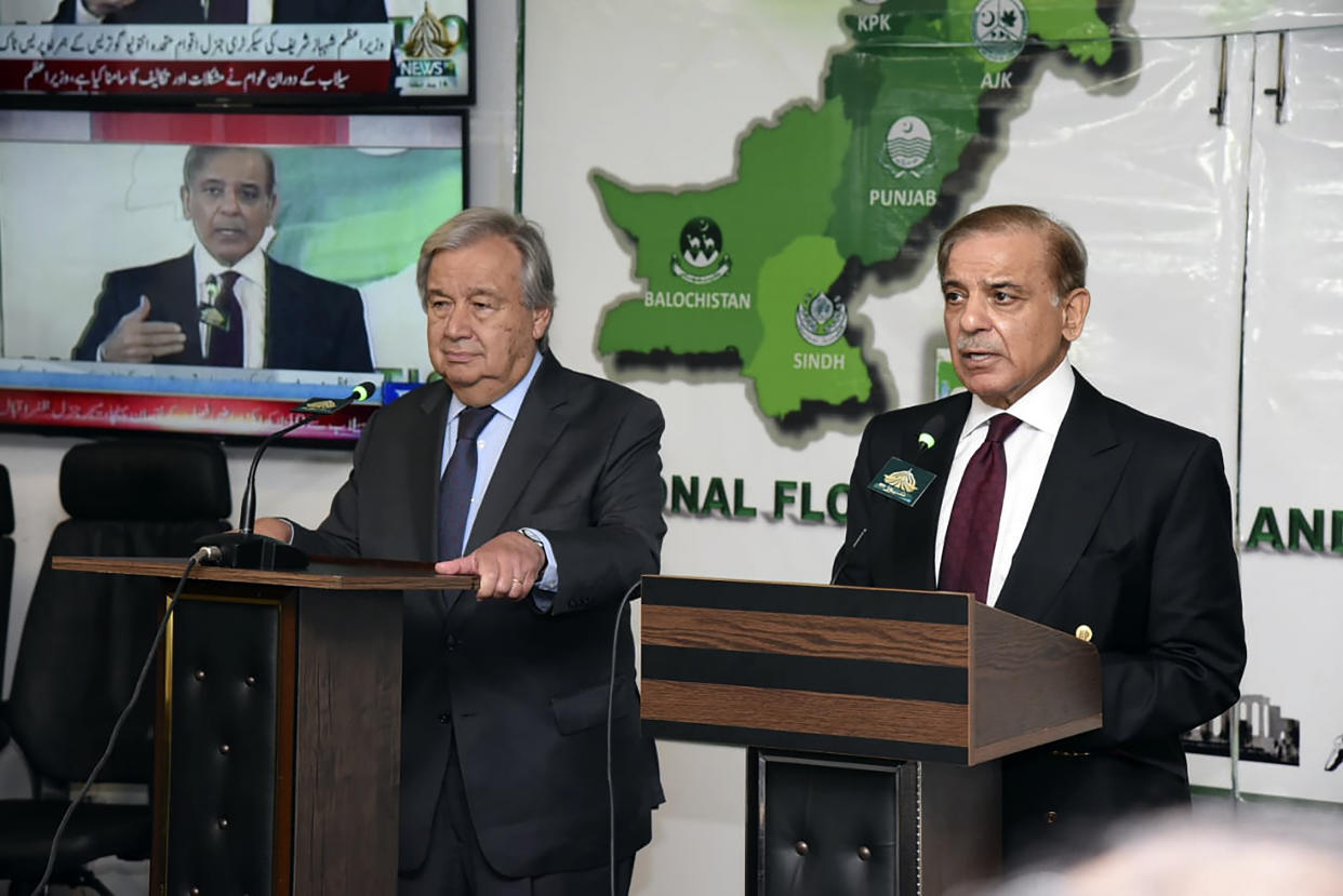 In this handout photo released by Pakistan Prime Minister Office, Prime Minister Shahbaz Sharif, right, speaks during a joint press conference with U.N. Secretary-General Antonio Guterres at the Prime Minister House in Islamabad, Pakistan, Friday, Sept. 9, 2022. Guterres appealed to the world for help for cash-strapped Pakistan after arriving in the country Friday to see the climate-induced devastation from months of deadly record floods. (Pakistan Prime Minister Office via AP)