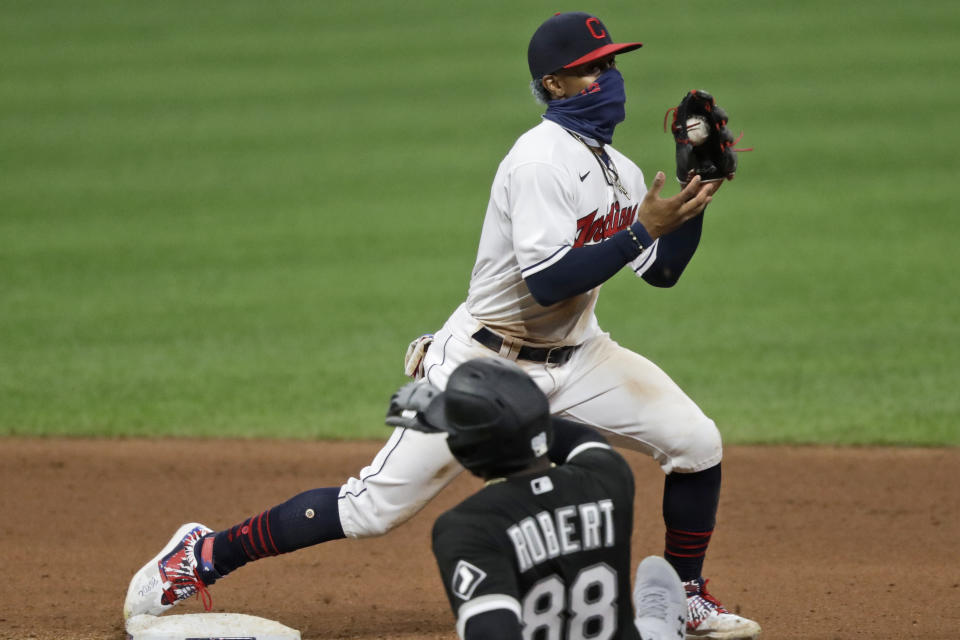 Cleveland Indians' Francisco Lindor gets Chicago White Sox's Luis Robert at second base in the seventh inning in the second baseball game of a doubleheader, Tuesday, July 28, 2020, in Cleveland. (AP Photo/Tony Dejak)