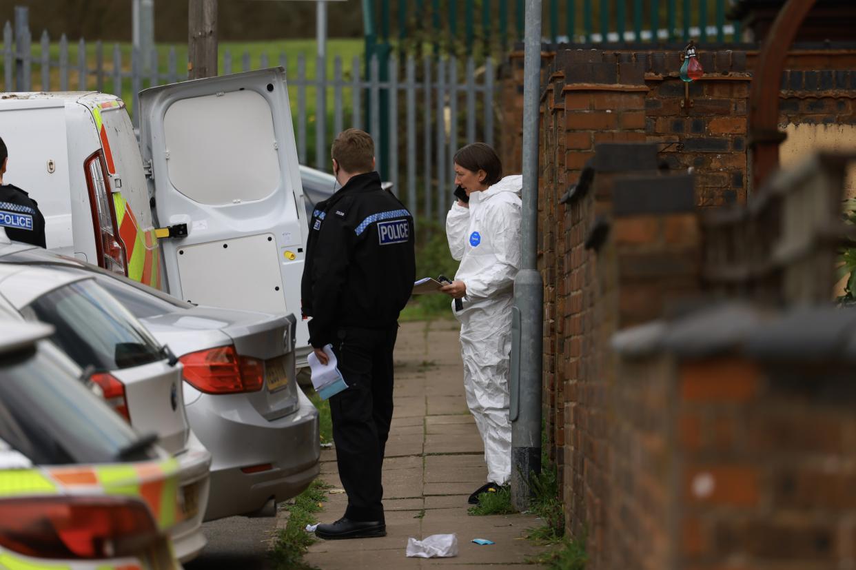 Police and forensics at the scene where a man's body was found hours after he was attacked in a nearby park. (Reach)