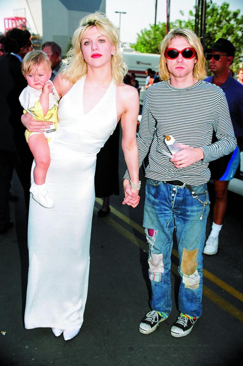 Love with Kurt Cobain and their daughter, Frances Bean, at the MTV Awards, 1993 (FilmMagic)