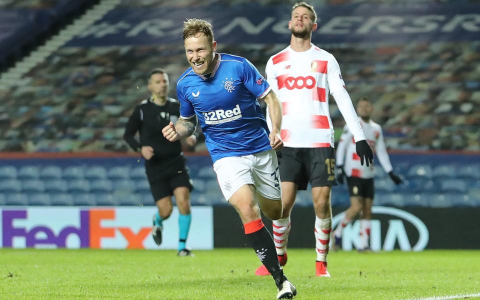 Scott Arfield celebrates scoring his side's third goal of the game during their impressive 3-2 win over Standard Liege  - PA 