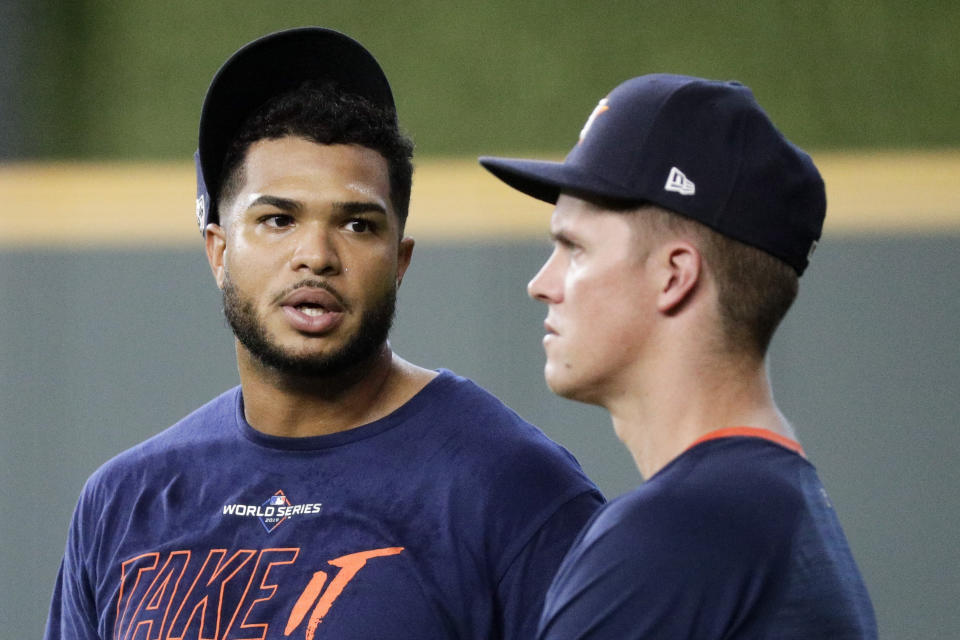 Houston Astros relief pitcher Josh James, left, talks with starting pitcher Zack Greinke during a practice day for baseball's World Series Monday, Oct. 21, 2019, in Houston. The Houston Astros face the Washington Nationals in Game 1 on Tuesday. (AP Photo/Eric Gay)