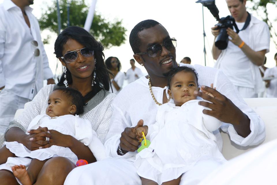 Sean "Diddy" Combs and Kim Porter with their twin daughters D'Lila Star Combs and Jessie James Combs