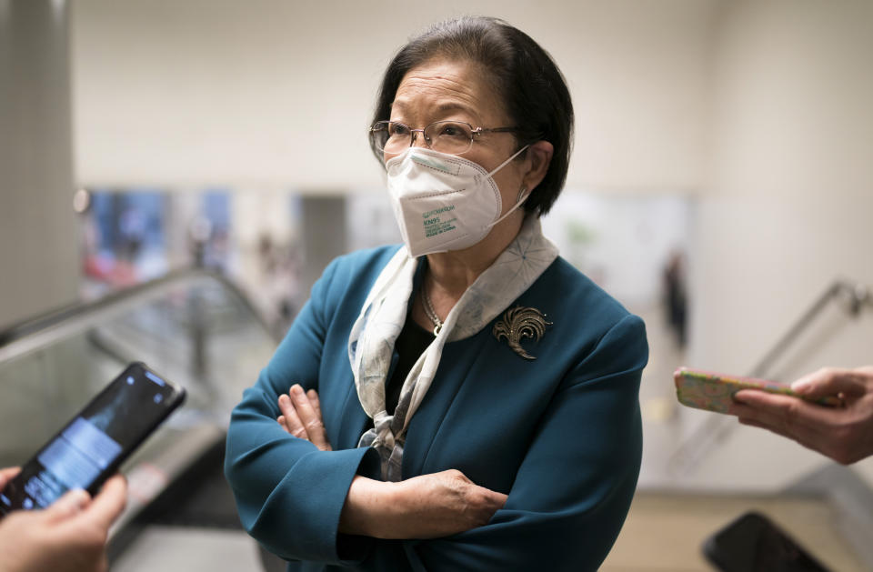 Sen. Mazie Hirono, D-Hawaii, pauses for reporters as senators head to the chamber for a procedural vote on the nomination of Shalanda Young to be deputy director of the Office of Management and Budget, at the Capitol in Washington, Tuesday, March 23, 2021. (AP Photo/J. Scott Applewhite)