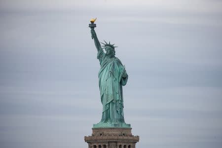 The Statue of Liberty is seen in New York Harbor in New York City, U.S., June 27, 2018. REUTERS/Brendan McDermid/Files