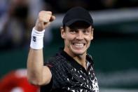 Tomas Berdych of the Czech Republic celebrates defeating Kevin Anderson of South Africa in his men's singles quarter-final tennis match at the Paris Masters tennis tournament at the Bercy sports hall in Paris, October 31, 2014. REUTERS/Benoit Tessier