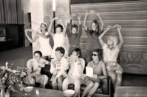 The "Original 9" women's tennis players pose with dollar bills Sept. 23, 1970, at the Houston Racquet Club.