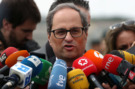 Newly elected Catalan regional leader Quim Torra speaks to reporters outside the Estremera prison where he visited former Catalan cabinet members Oriol Junqueras, Jordi Turull, Joaquim Forn, Josep Rull and Raul Romeva who are jailed there pending trial on charges of sedition, rebellion and misappropriation of funds, in Estremera, Spain, May 21, 2018. REUTERS/Sergio Perez