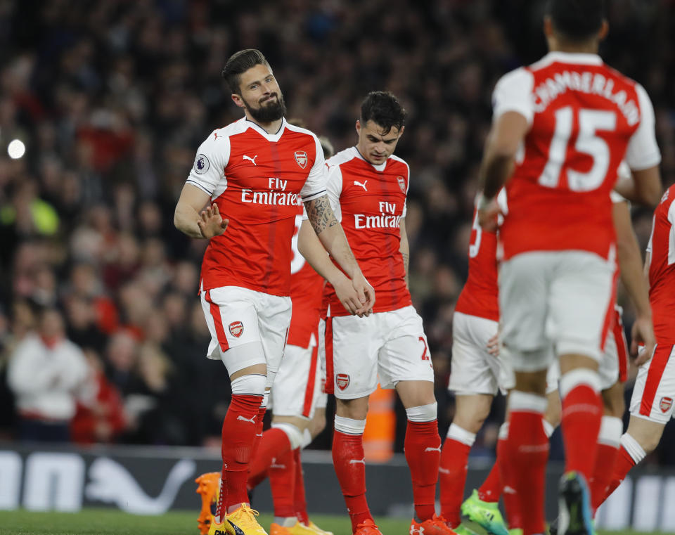 Arsenal's Olivier Giroud, left, celebrates his goal during the English Premier League soccer match between Arsenal and West Ham at the Emirates stadium in London, Wednesday, April 5, 2017.(AP Photo/Frank Augstein)