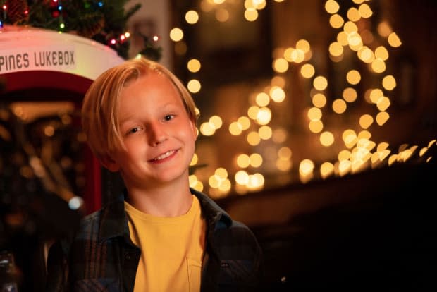 <p>Caden Dragomer stars in <em>A Country Christmas Harmony</em><br> ©2022 A+E Networks, LLC. All rights reserved.<br> Photo Credit: Victor Curtis / Courtesy of A+E Networks and Lifetime</p>