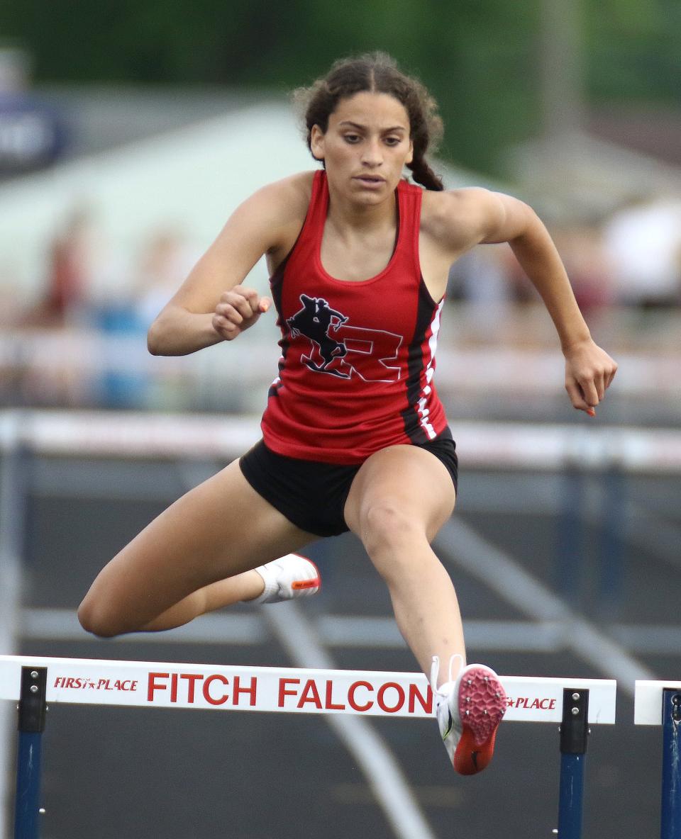 Kent Roosevelt's Lea Parham during the girls 300-meter hurdle final at Division I district track and field finals at Austintown Fitch High School Friday, May 20, 2022.