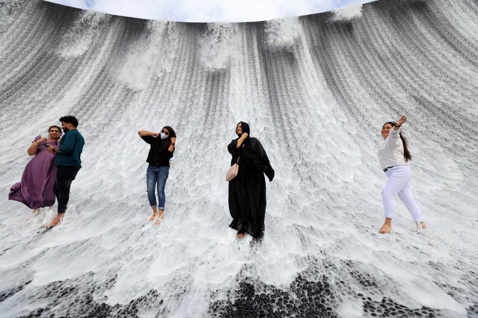 Visitors are pictured at the water feature at Dubai Expo 2020, in Dubai, United Arab Emirates, January 16, 2022. REUTERS/Christopher Pike TPX IMAGES OF THE DAY