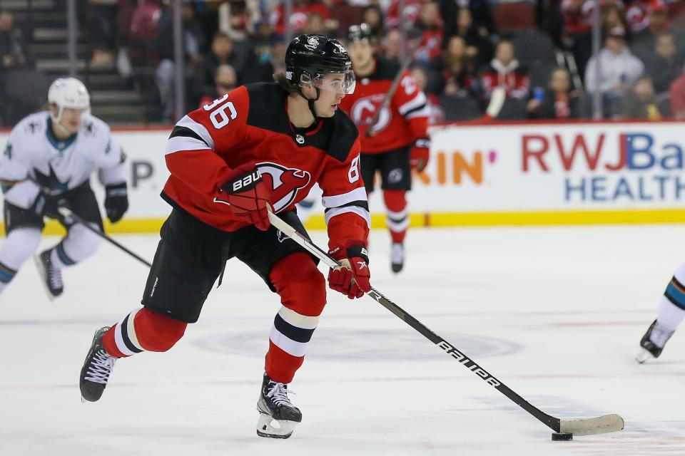 New Jersey Devils center Jack Hughes (86) skates with the puck during the second period against San Jose Sharks at Prudential Center.