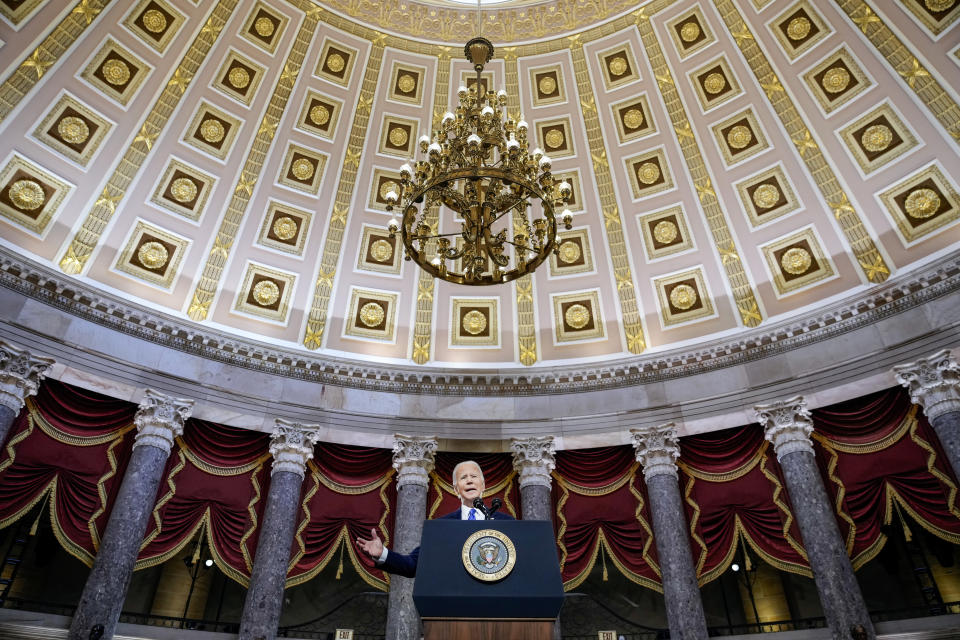 President Biden speaking at a podium.