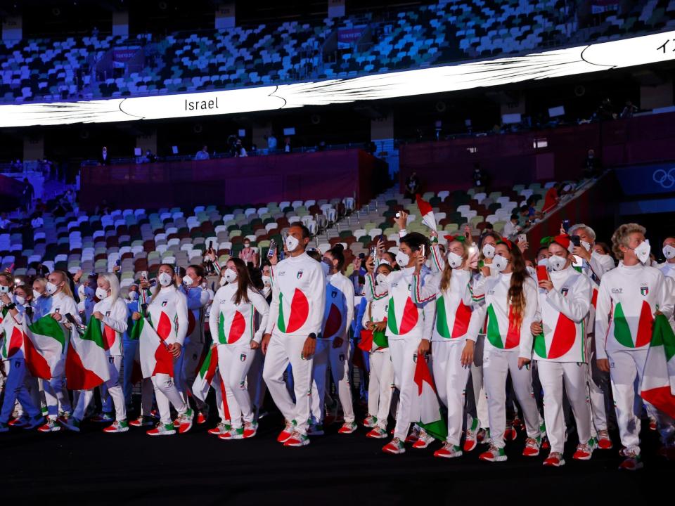 Team Italy enters Tokyo's Olympic Stadium for the opening ceremony.