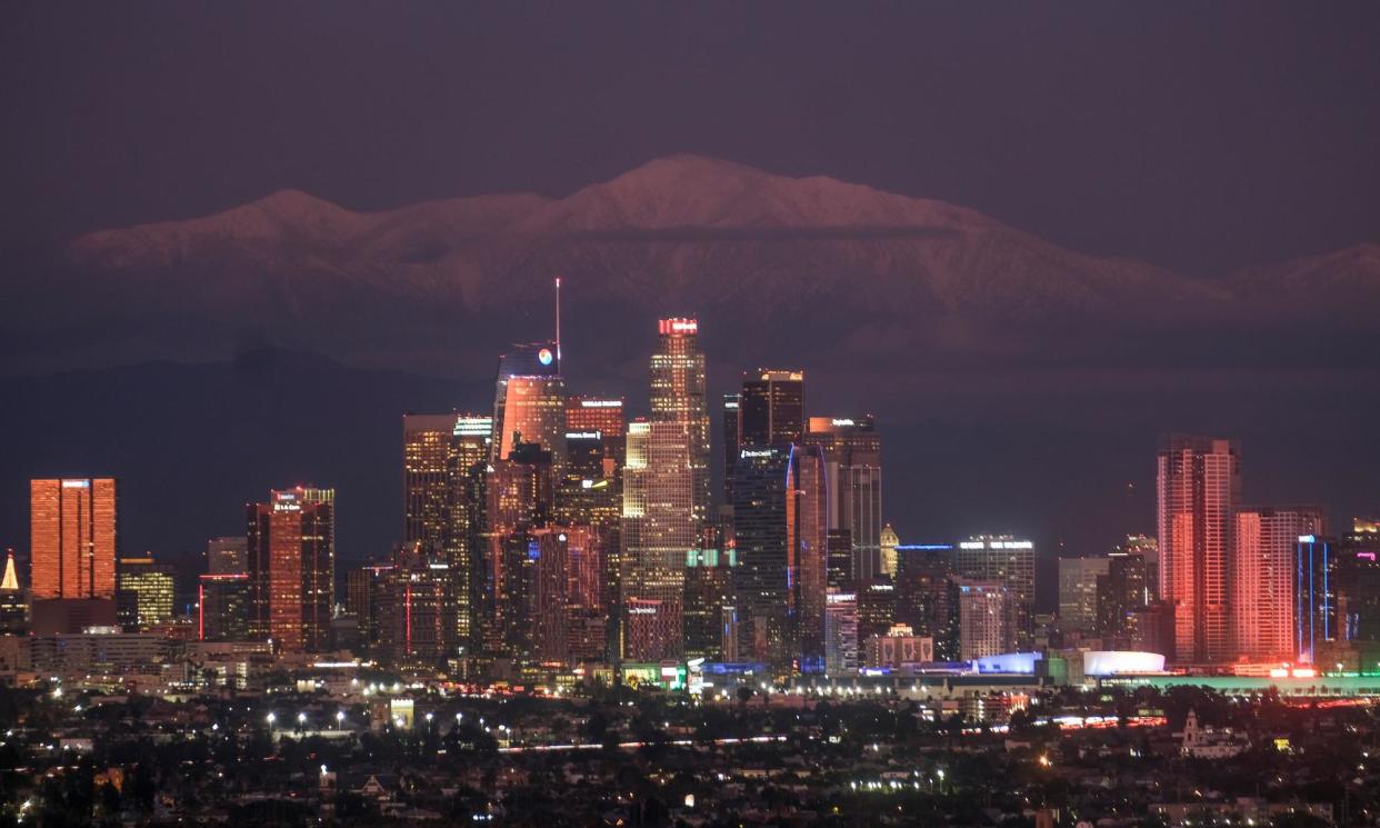 <span>The Los Angeles skyline with snow mountains in background as seen from Kenneth Hahn state recreation area.</span><span>Photograph: Ringo Chiu/ZUMA Press Wire/REX/Shutterstock</span>