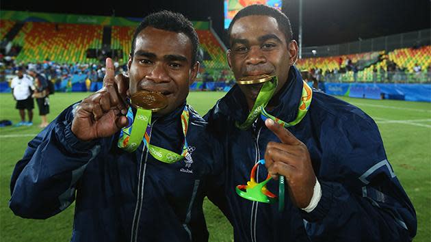 The Fijians celebrate their incredible victory.