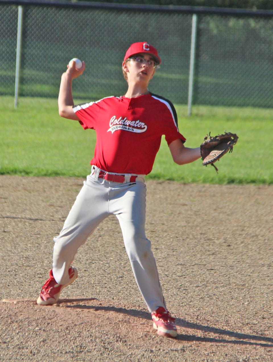 Coldwater's Caiden S. delivers a pitch Friday night in 12U baseball action