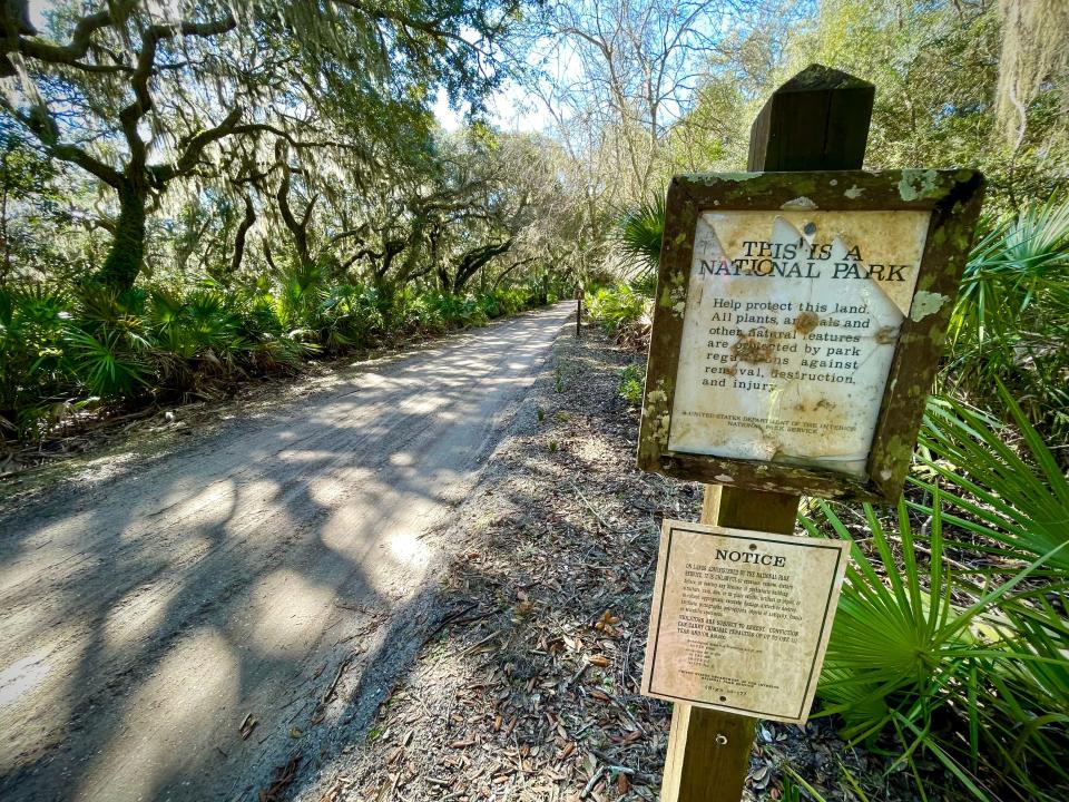 A sign on the main road of Cumberland Island National Seashore reminds visitors that this is a national park. Established in 1972, it is one of the National Park Service's more than 400 sites.
