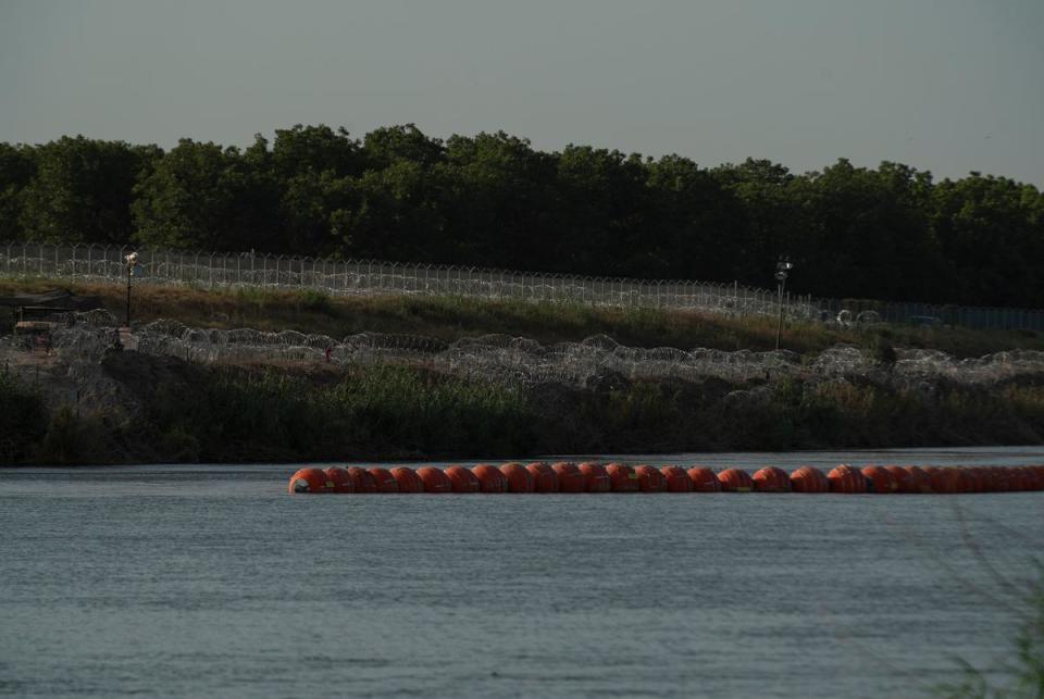 Concertina wire, barbed wire fencing and the recently installed buoys from the Piedras Negras side of the border.