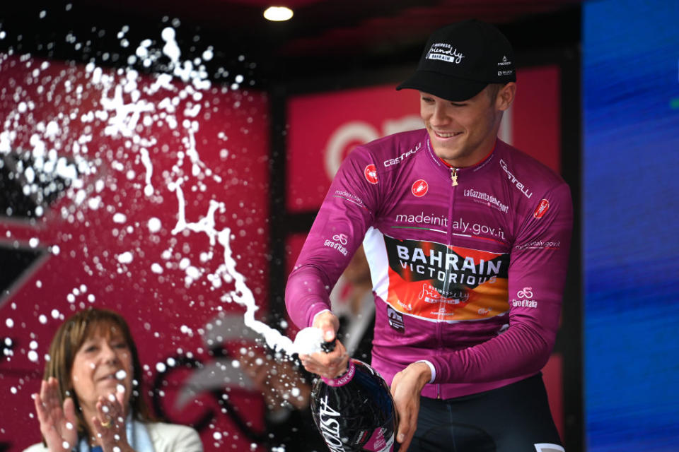 TORTONA ITALY  MAY 17 Jonathan Milan of Italy and Team Bahrain  Victorious celebrates at podium as Purple Points Jersey winner during the 106th Giro dItalia 2023 Stage 11 a 219km stage from Camaiore to Tortona  UCIWT  on May 17 2023 in Tortona Italy Photo by Tim de WaeleGetty Images