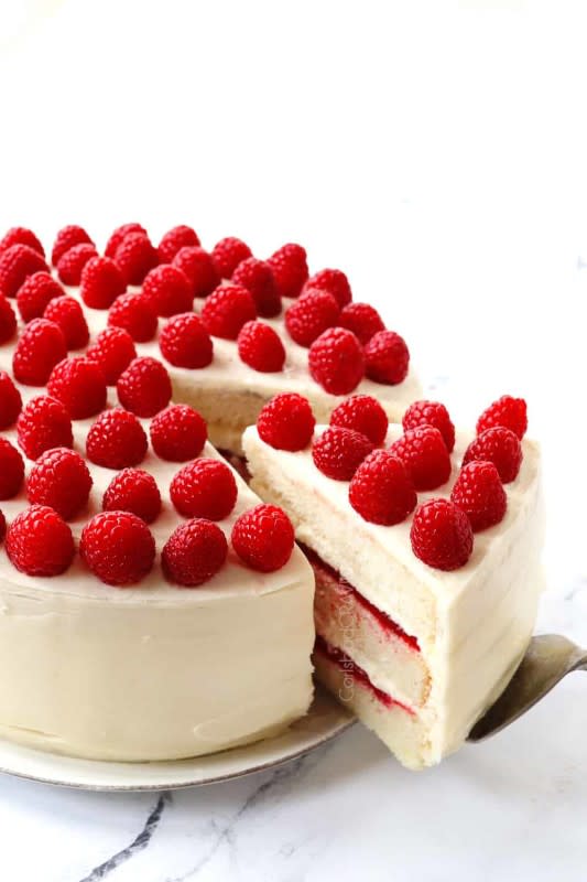 <p>Carlsbad Cravings</p><p>This white chocolate raspberry cake is made of layers of soft, airy, buttery vanilla cake, luscious raspberry filling and white chocolate cream cheese frosting!</p><p><strong>Get the recipe: <a href="https://carlsbadcravings.com/white-chocolate-raspberry-cake" rel="nofollow noopener" target="_blank" data-ylk="slk:White Chocolate Raspberry Cake;elm:context_link;itc:0;sec:content-canvas" class="link ">White Chocolate Raspberry Cake</a></strong></p>