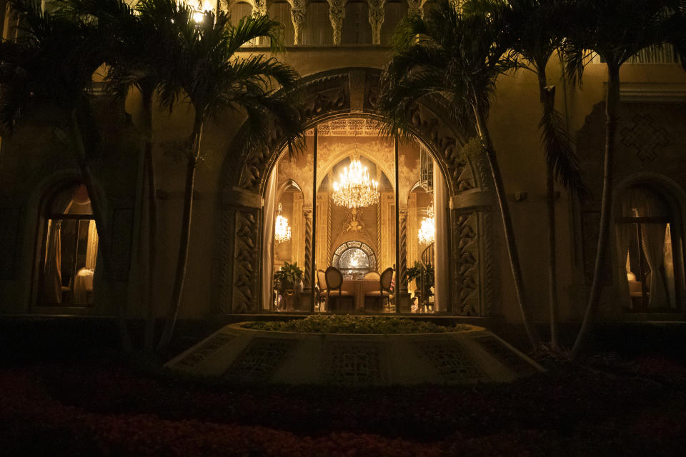 FILE - A window is illuminated at Mar-a-Lago during a dinner with President Donald Trump and Brazilian President Jair Bolsonaro, Saturday, March 7, 2020, in Palm Beach, Fla. (AP Photo/Alex Brandon, File)