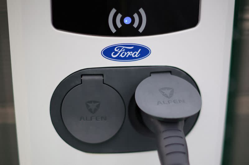 FILE PHOTO: A Ford logo is seen on an electric vehicle charging point during a press event at the Ford Halewood transmissions plant in Liverpool
