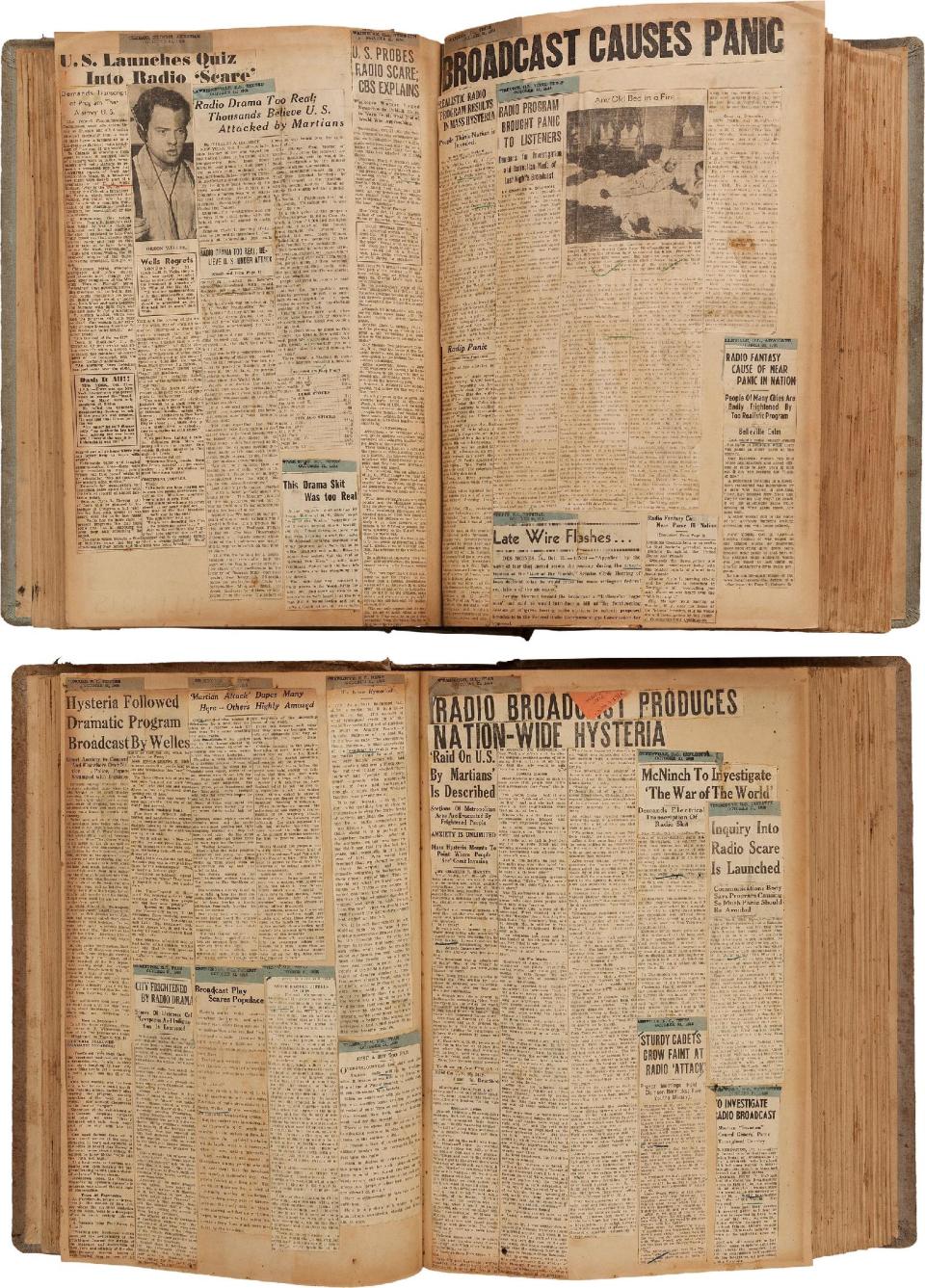 This photo provided by Heritage Auctions shows two scrapbooks filled with newspaper clippings about the nationwide panic from Orson Welles' 1938 radio broadcast of "War of the Worlds" which are among the Welle's items consigned by his daughter, Beatrice, that will be offered by Heritage Auctions in New York City on April 26, 2014. (AP Photo/Heritage Auctions) Photo credit: