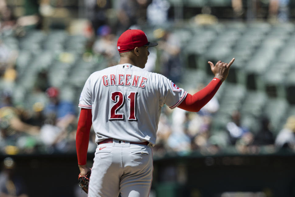 Cincinnati Reds starting pitcher Hunter Greene gestures before throwing against an Oakland Athletics batter during the fifth inning of a baseball game in Oakland, Calif., Saturday, April 29, 2023. (AP Photo/John Hefti)