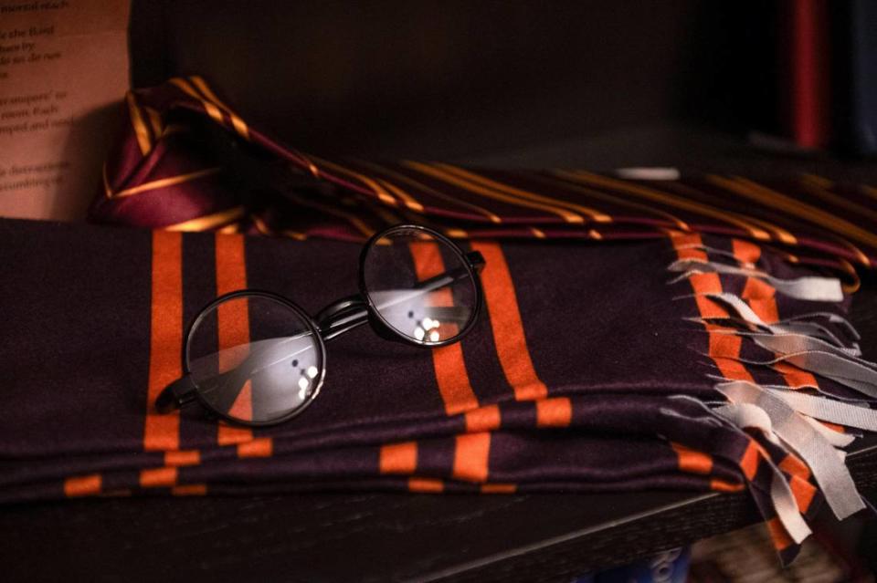 Harry Potter’s glasses and scarf lie on a shelf in the Gryffindor House common room built into Andreas and Becca Stabno’s tornado room in Lee’s Summit