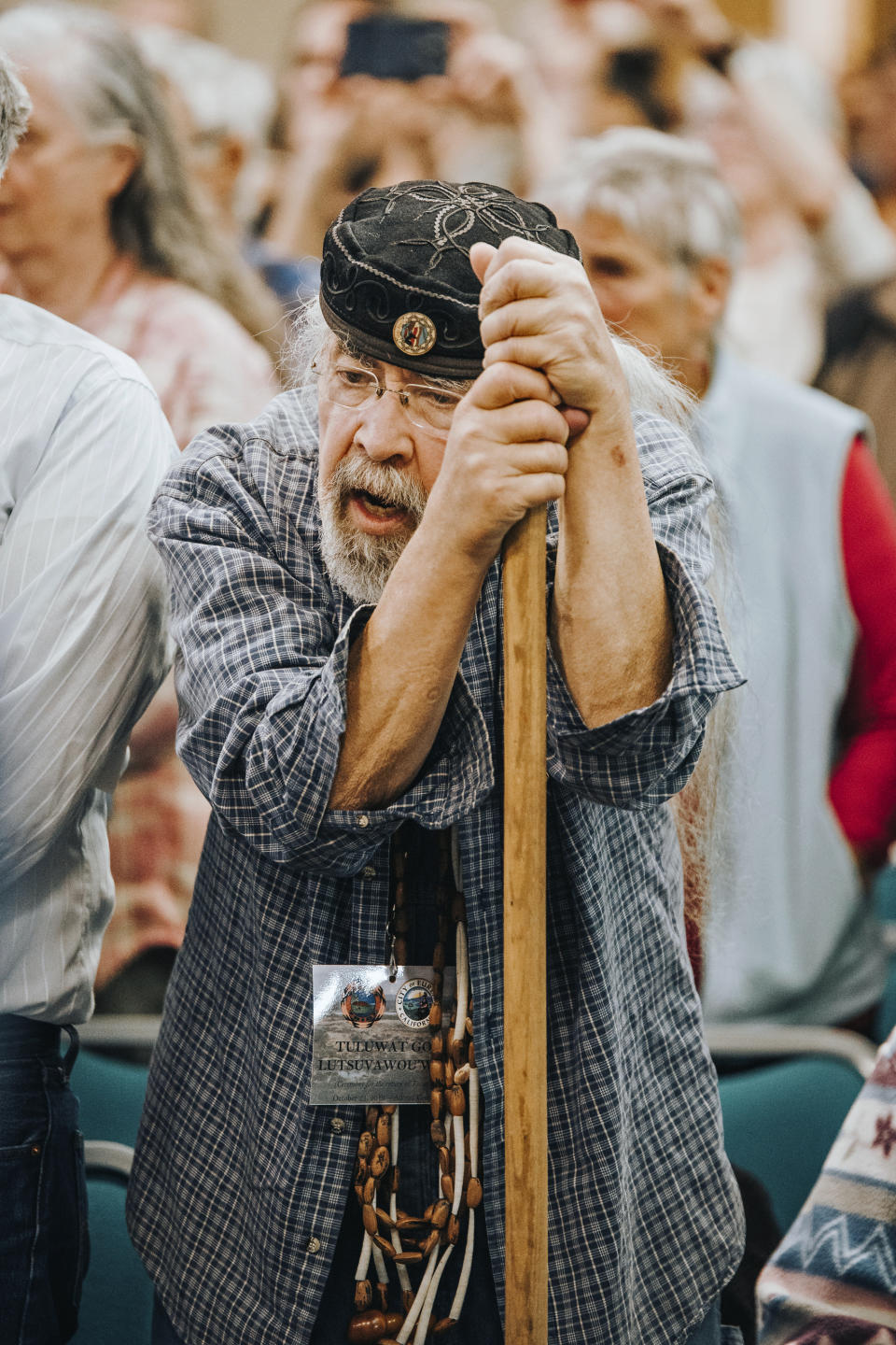 In this Monday Oct. 21, 2019, provided by Eddy Alexander, people fill the Adorni Center to witness the deed transfer of Indian Island during a ceremony in Eureka, Calif. Indian Island off the coast of Northern California was the site of a massacre, a place that was contaminated by a shipyard and flush with invasive species. It's also the spiritual and physical center of the universe for the small Wiyot Tribe, and it now belongs to them almost entirely after a city deeded all the land it owns on the island to the tribe during a packed signing ceremony Monday. (Eddy Alexander via AP)