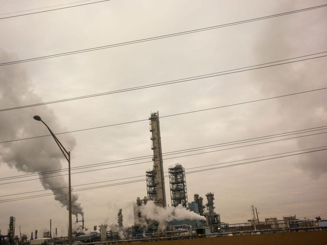 Smoke pours out of towers of the Phillips 66 Bayway oil refinery along the New Jersey Turnpike in Linden, New Jersey, December 11, 2019. (Robert Nickelsberg_Getty Images)