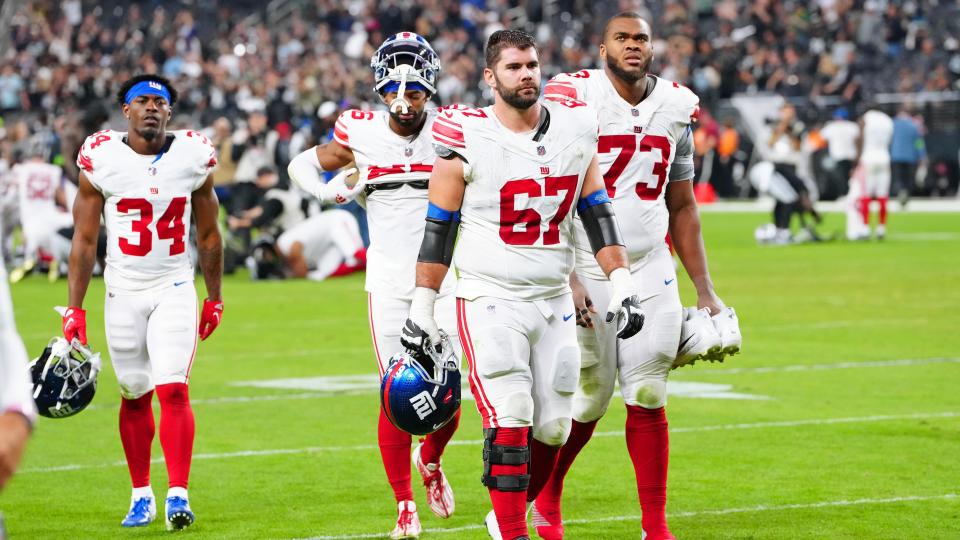 Nov 5, 2023; Paradise, Nevada, USA; New York Giants head players walk off the field after the Las Vegas Raiders defeated the Giants 30-6 at Allegiant Stadium. Mandatory Credit: Stephen R. Sylvanie-USA TODAY Sports