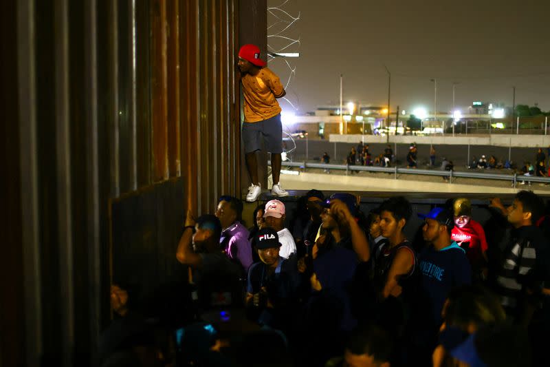 Migrants gather near the border to request asylum in the United States, in Ciudad Juarez