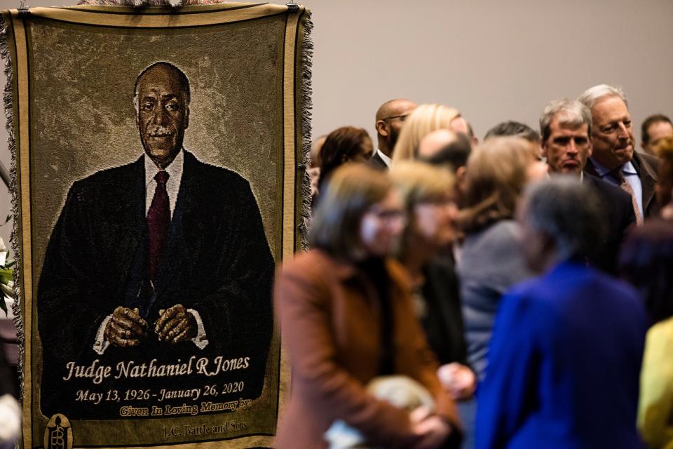 A tapestry hangs in remembrance of Judge Nathaniel Jones as people wait in the visitation line on Wednesday, Jan. 29, 2020, at Corinthian Baptist Church in Bond Hill. Jones died at the age of 93.