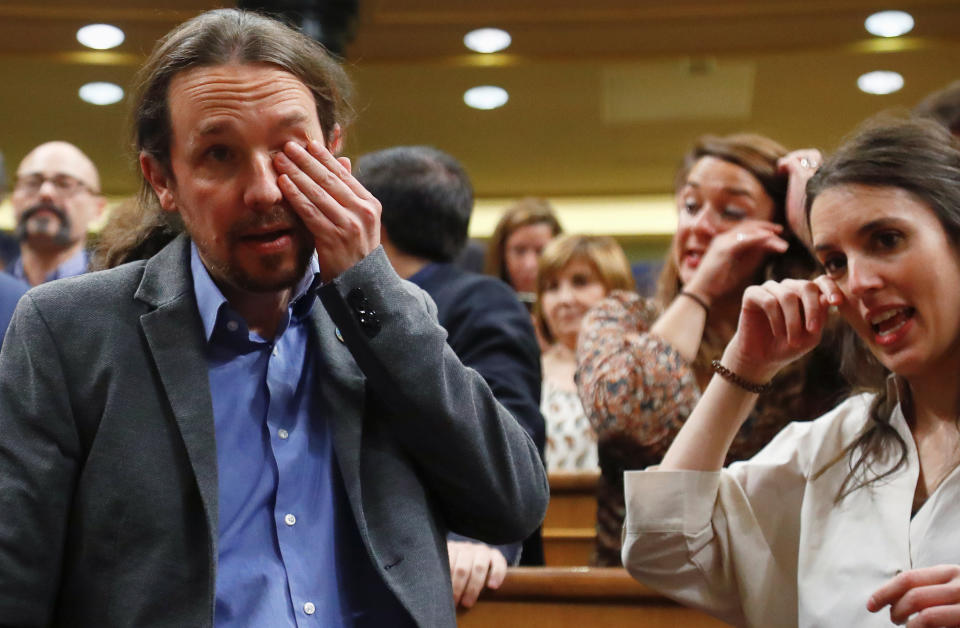 Pablo Iglesias, Unidas Podemos (Together We Can) leader, and his partner, party member Irene Montero react after Spain's Prime Minister Pedro Sanchez won the parliamentary vote following the investiture debate at Parliament in Madrid, Spain, January 7, 2020. REUTERS/Stringer