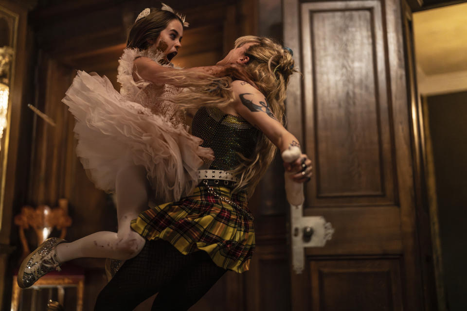 This image released by Universal Pictures shows Alisha Weir and Kathryn Newton in a scene from the film "Abigail." (Bernard Walsh/Universal Pictures via AP)