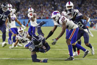 Tennessee Titans running back Derrick Henry (22) dives into the end zone as he scores a touchdown on a 13-yard run against the Buffalo Bills in the second half of an NFL football game Monday, Oct. 18, 2021, in Nashville, Tenn. (AP Photo/Wade Payne)