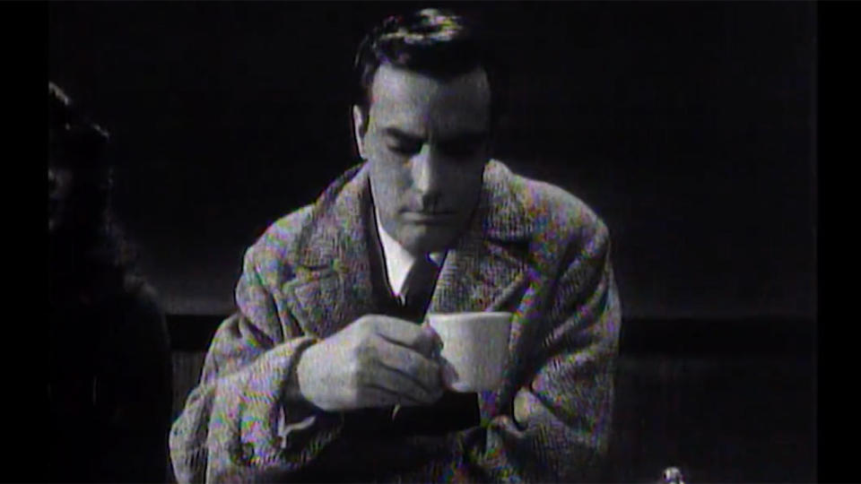 Peter Aykroyd drinking coffee in the black and white SNL sketch The Java Junkie.