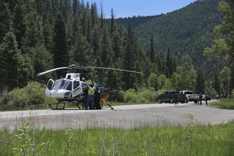 Medical staff transfer an elderly patient from a an ambulance to a helicopter on Friday, July 2, 2021, in the Carson National Forest, outside of Taos, N.M.. The man fell ill at a remote encampment as part of the annual Rainbow Gathering. More than 2,000 people have made the trek into the mountains of northern New Mexico as part of an annual counterculture gathering of the so-called Rainbow Family. While past congregations on national forest lands elsewhere have drawn as many as 20,000 people, this year’s festival appears to be more reserved. Members (AP Photo/Cedar Attanasio)