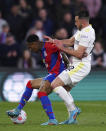 Crystal Palace's Nathaniel Clyne, left, and Leeds United's Jack Harrison battle for the ball during the English Premier League soccer match between Crystal Palace and Leeds United at Selhurst Park, London, Monday April 25, 2022. (John Walton/PA via AP)