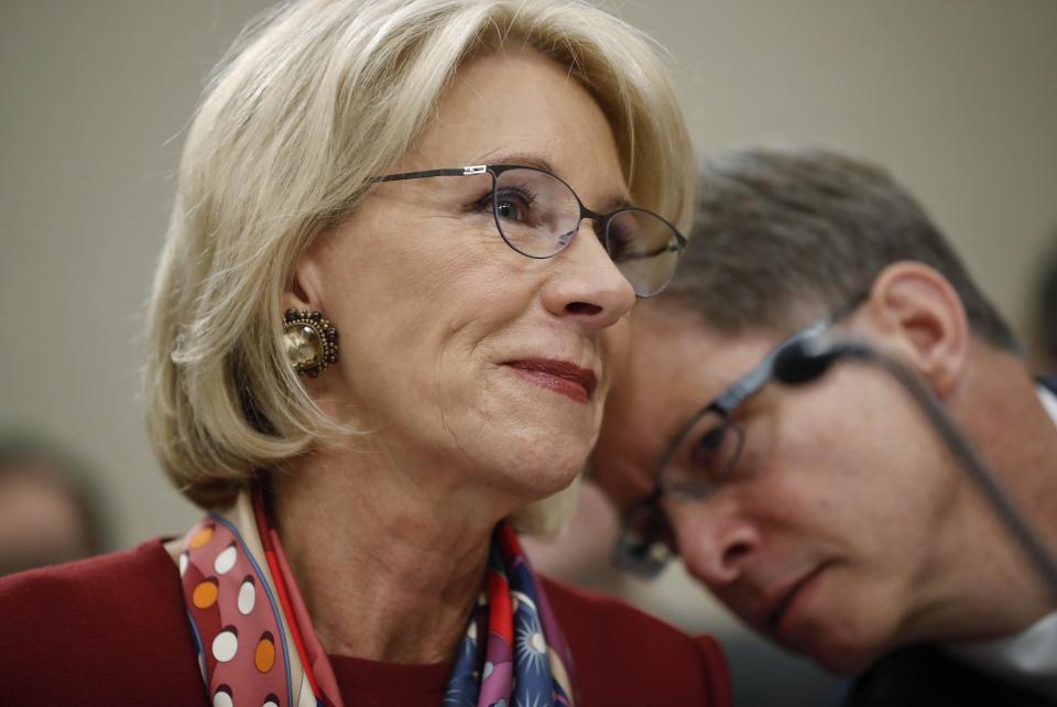 WASHINGTON -- Education Secretary Betsy DeVos (left) leans over to listen to Bill Cordes, U.S. Department of Education Budget Service Elementary, Secondary and Vocational Analysis Division Director, as they wait to testify before a House Committee on Appropriation subcommittee hearing.