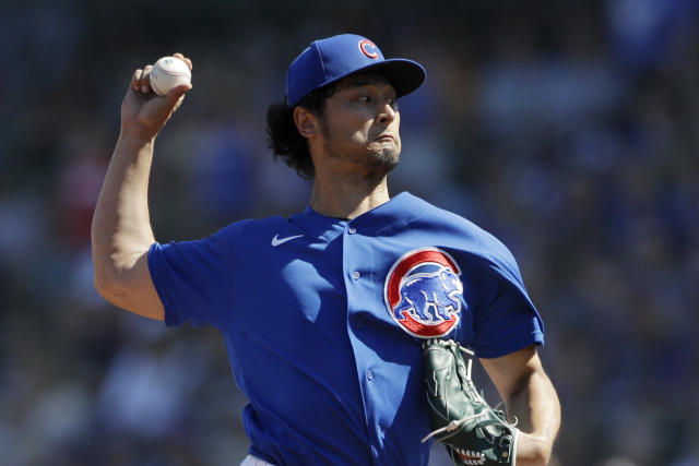 Chicago Cubs starting pitcher Yu Darvish works against a Milwaukee Brewers  batter during the first inning of a spring training baseball game Saturday,  Feb. 29, 2020, in Mesa, Ariz. (AP Photo/Gregory Bull