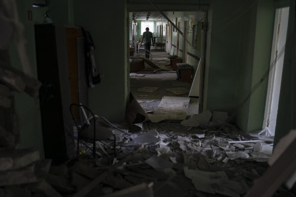 FILE - A man walks in a corridor of a psychiatric hospital that was heavily damaged after a Russian attack in Kramatorsk, Ukraine, Sept. 7, 2022. In December, the World Health Organization said one in five people in countries that have experienced conflict in the past decade will suffer from a mental health condition, and estimated that about 9.6 million people in Ukraine could be affected. Russia’s invasion in February 2022 resulted in millions of people being displaced, bereaved, forced into basements for months due to incessant shelling or enduring harrowing journeys from Russian-occupied regions. (AP Photo/Leo Correa, File)