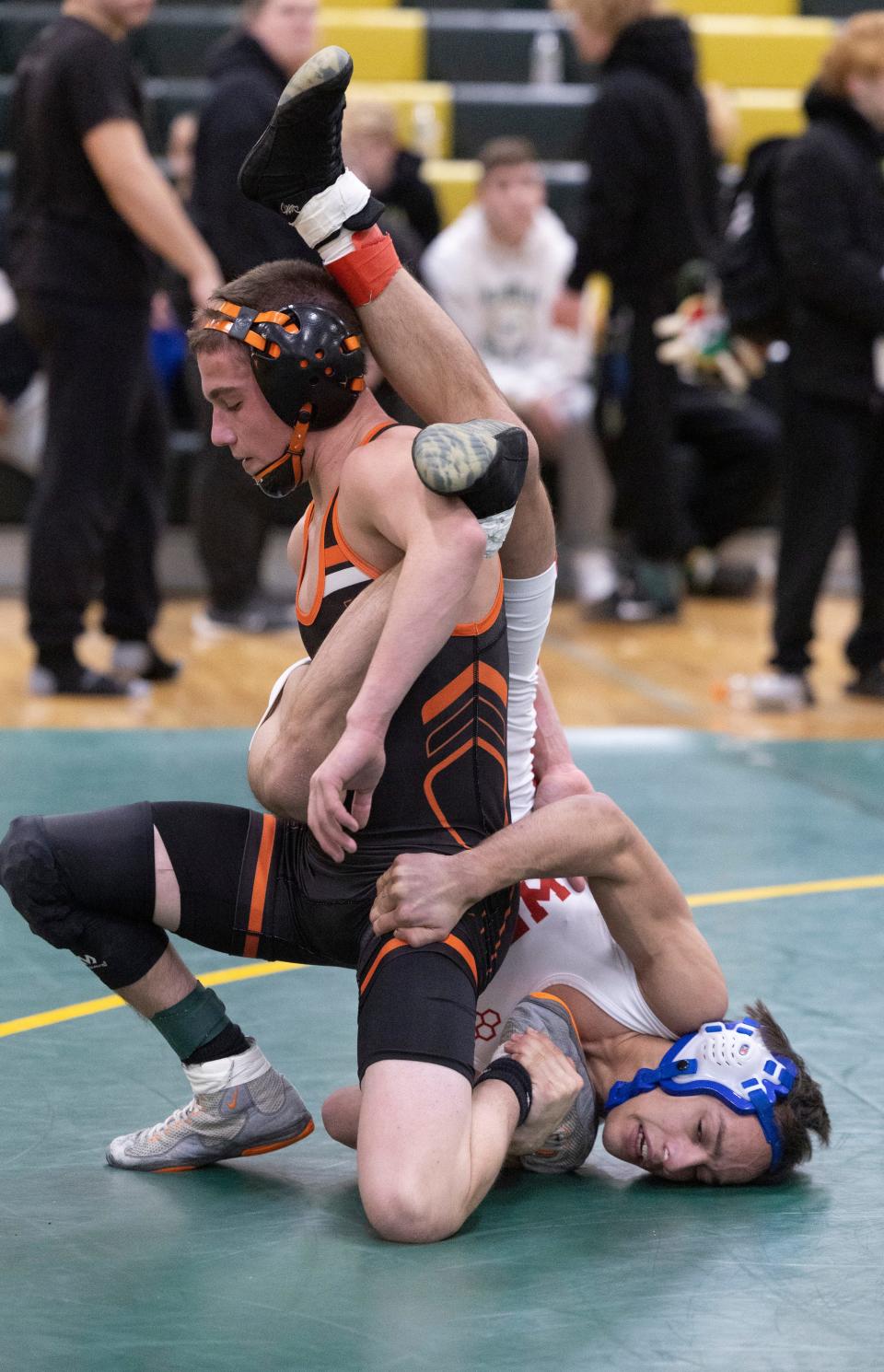 Middletown North's Brady Klinsky (left) defeated Wall's Michael DiBiase 4-2 Wednesday in the Mustang Classic 106-pound final.