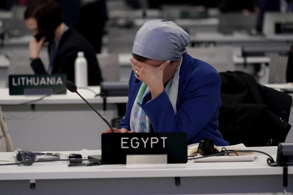 Dr. Yasmine Fouad the Minister of Environment for Egypt who will host the next COP, COP27, attends a stocktaking plenary session at the COP26 U.N. Climate Summit, in Glasgow, Scotland, Saturday, Nov. 13, 2021. Going into overtime, negotiators at U.N. climate talks in Glasgow are still trying to find common ground on phasing out coal, when nations need to update their emission-cutting pledges and, especially, on money. (AP Photo/Alberto Pezzali)