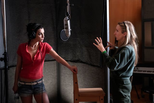 <p>Courtesy of Dean Rogers/Focus Features</p> Marisa Abela (left) and director Sam Taylor-Johnson on the set of Back to Black