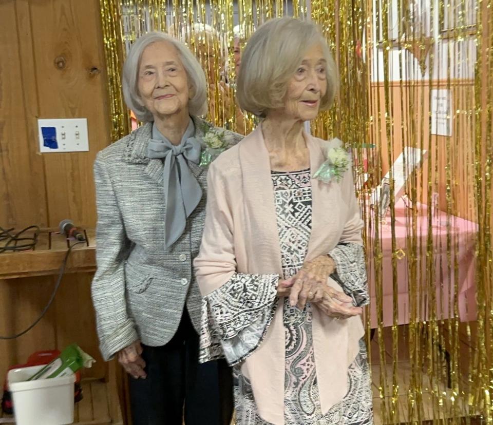 Era Herring Luckie Daniell, left, and her twin sister, Vera Herring Rozier enter the Wewahitchka Senior Citizens and Community Center on Thursday for a birthday celebration. The twin ladies turned 100 on Feb. 8, 2024.