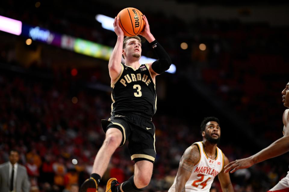 Purdue guard Braden Smith (3) goes to the basket past Maryland forward Donta Scott (24) during the first half of an NCAA college basketball game Tuesday, Jan. 2, 2024, in College Park, Md. (AP Photo/Nick Wass)